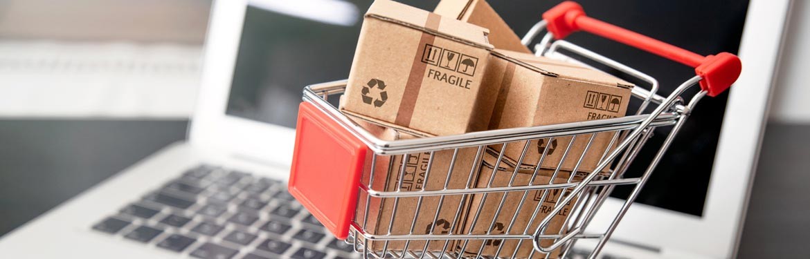 Shopping cart with boxes on a laptop computer